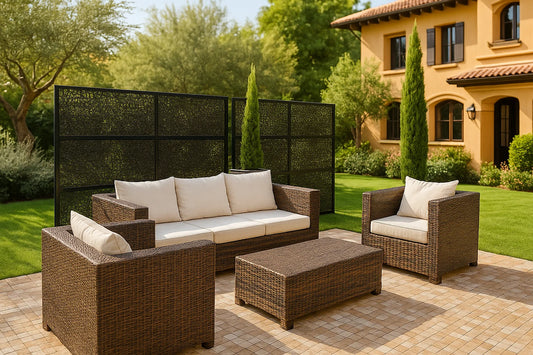 Outdoor patio furniture set with cushions on a patio in front of a house.